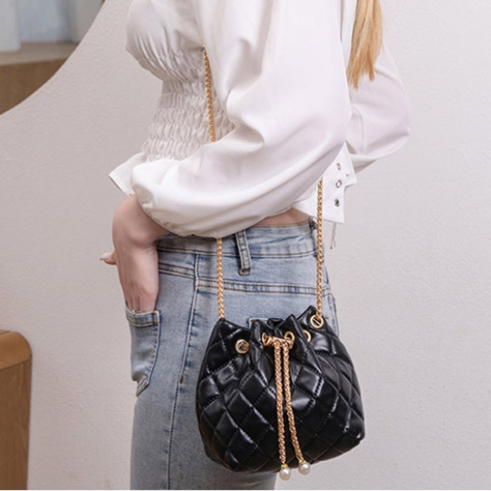 Black quilted bucket bag